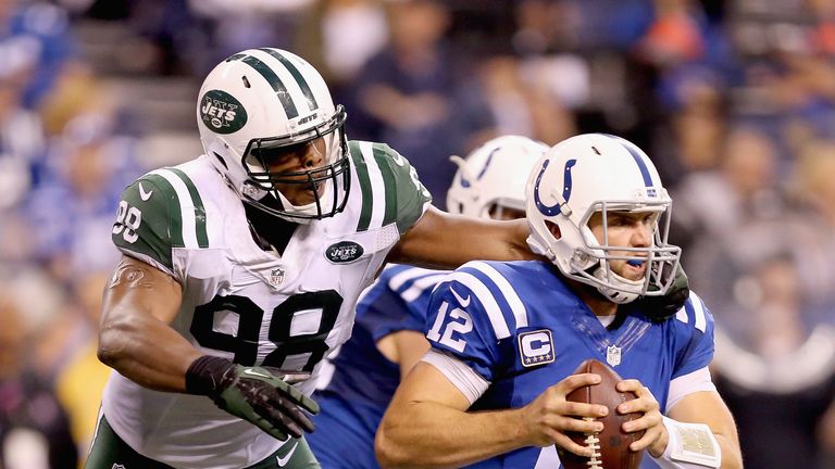 Andrew Luck looks for a team-mate with a Jet closing in