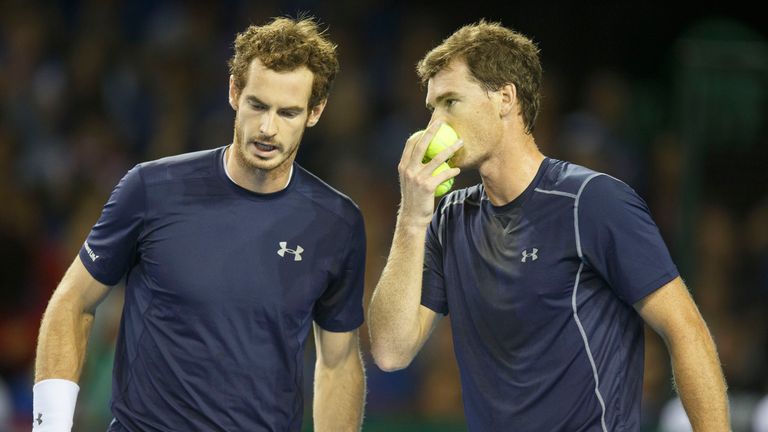 Andy Murray (L) takes some advice from brother Jamie Murray of Great Britain  during day 2 of the Great Britain v 