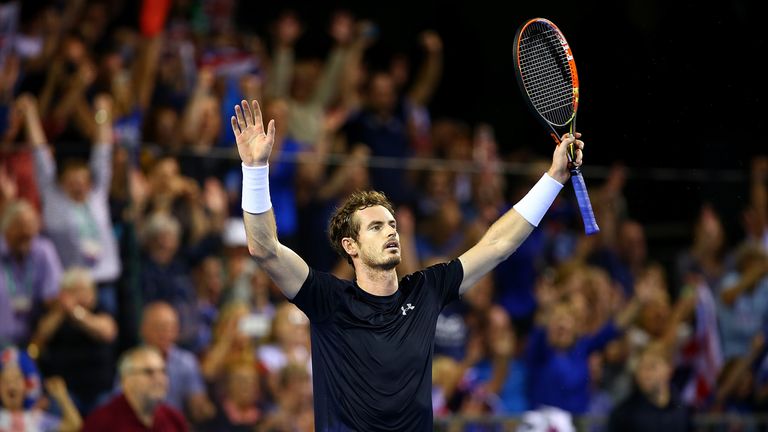 Andy Murray celebrates after his straight sets defeat of Bernard Tomic