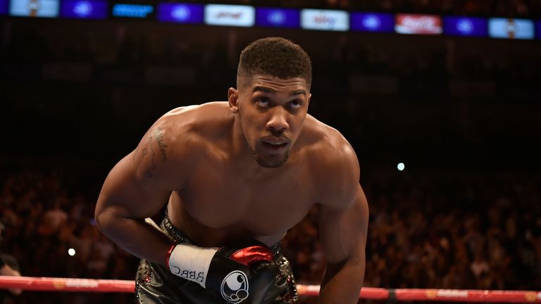 Anthony Joshua takes a bow after his 14th straight KO