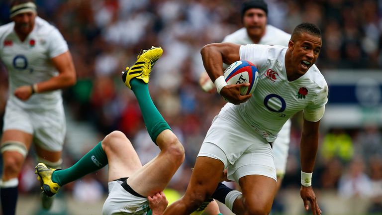 Anthony Watson of England breaks away from Jonny Sexton of Ireland during the sides' Rugby World Cup warm-up match