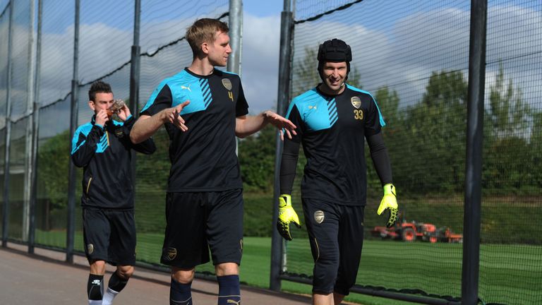 Per Mertesacker and Petr Cech of Arsenal before a training session at London Colney on September 28, 2015 in St Albans, England.