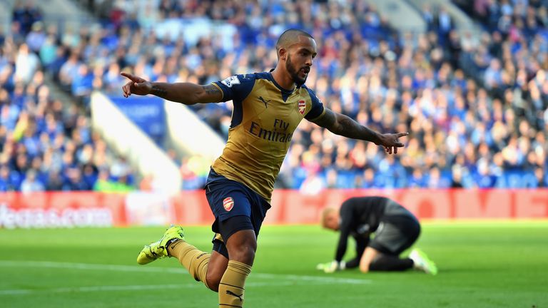 Theo Walcott of Arsenal celebrates scoring his team's first goal against Arsenal