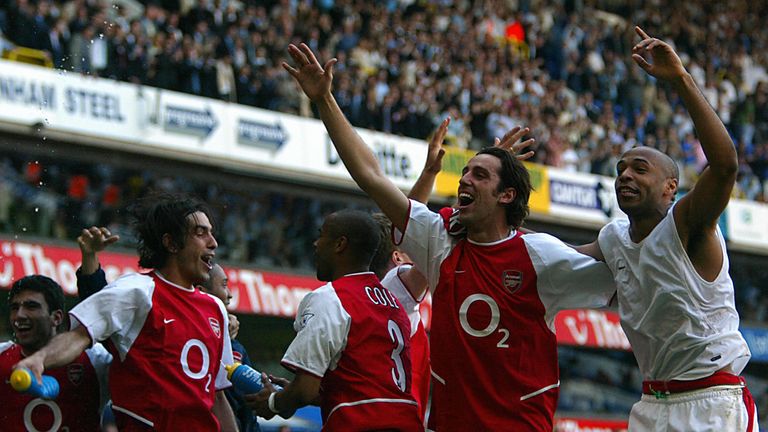 Arsenal's L to R Jose Antonio Reyes, Robert Pires ,Ashley Cole, Edu and Thierry Henry  celebrates winning the 2003/2004 title at White Hart Lane