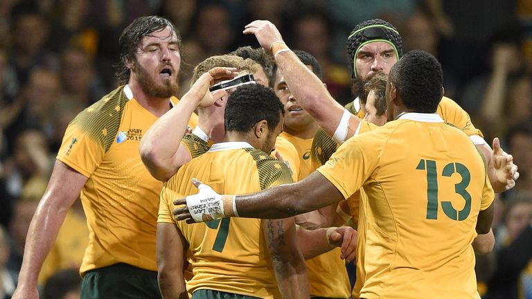 The Wallabies celebrate a David Pocock try