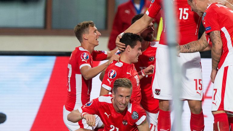 Austria's Zlatko Junuzovic is congratulated