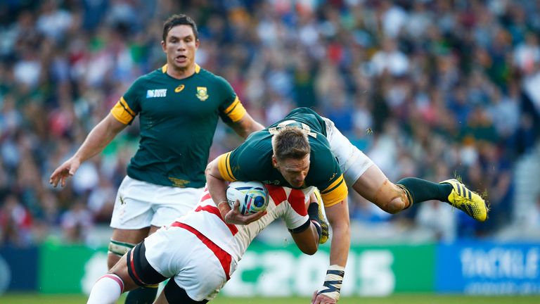 Ayumu Goromaru of Japan tackles Jean De Villiers of South Africa during the 2015 Rugby World Cup