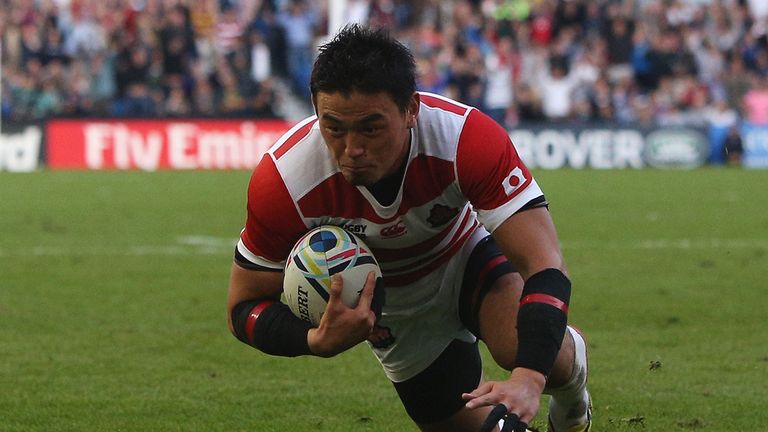 Ayumu Goromaru of Japan dives over the score his team's second try 