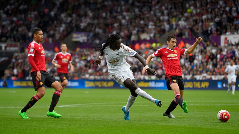 Bafetimbi Gomis shoots to score the second Swansea goal during the 2-1 win over Manchester United on August 30, 2015.