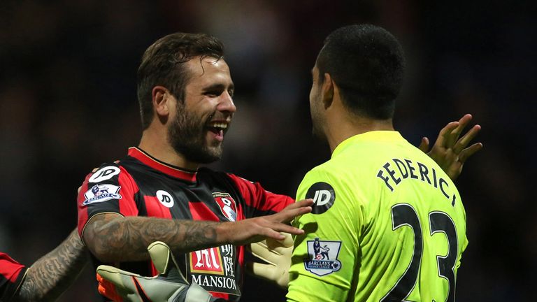 AFC Bournemouth's Baily Cargill (centre) and Lee Tomlin congratulate goalkeeper Adam Federici (right) after he saved the final penalty to secure a win duri