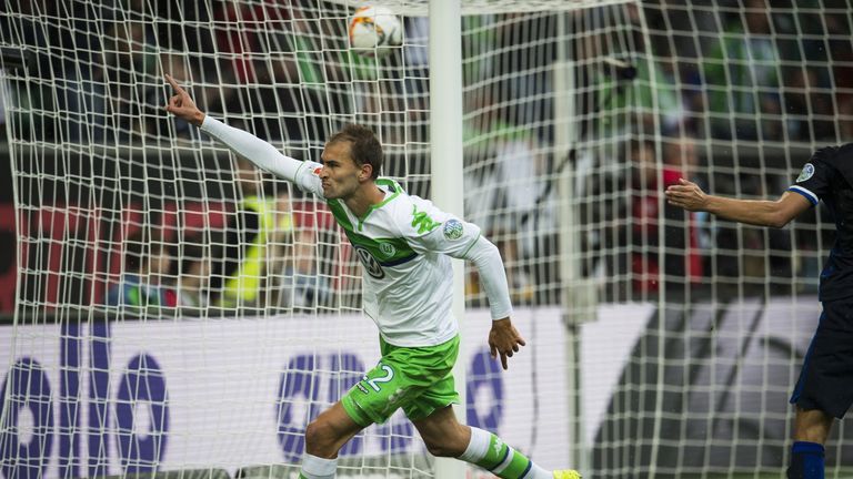 Wolfsburg's Bas Dost celebrates after scoring a penalty