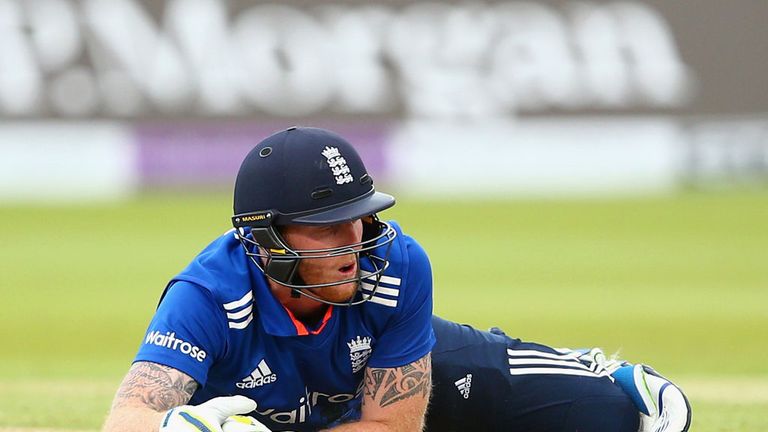 Ben Stokes hits the turf as Mitchell Starc shies at his stumps