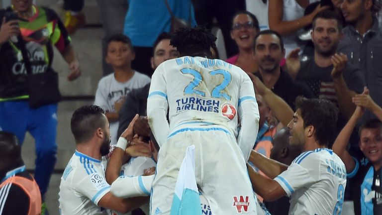 Marseille's players celebrate after Marseille's French defender Benjamin Mendy scored a goal