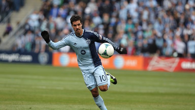 Benny Feilhaber #10 of Sporting Kansas City chases down a loose ball against the Chicago Fire at Sporting Park on March 16, 201