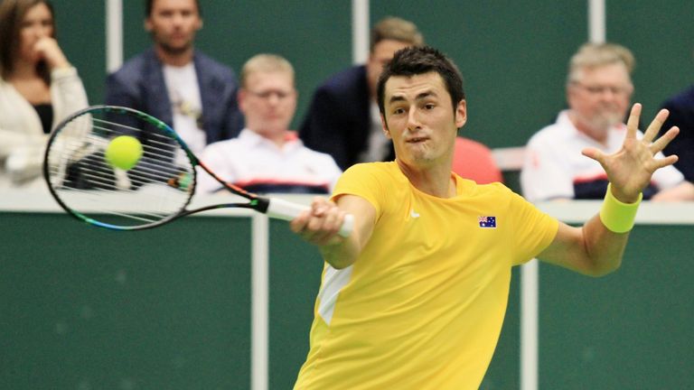 Australia's Bernard Tomic returns the ball to Czech Republic's Lukas Rosol during the first round Davis Cup match in Ostrava