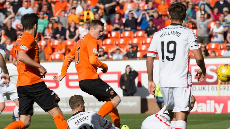 Billy McKay (centre) fires the ball home to open the scoring for Dundee United