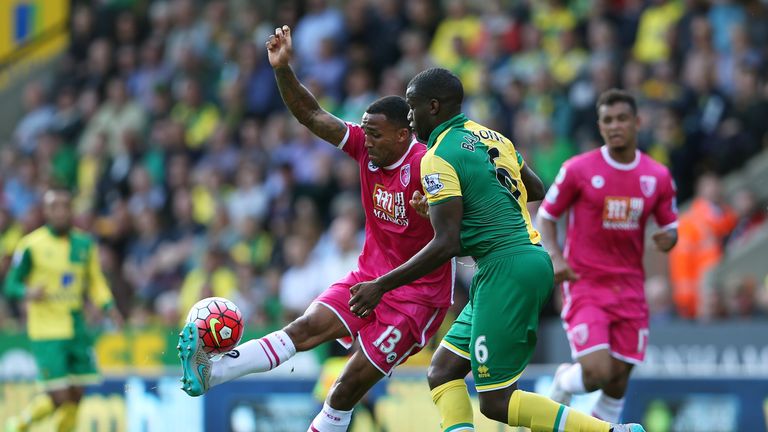 Callum Wilson of Bournemouth is challenged by Sebastien Bassong of Norwich City