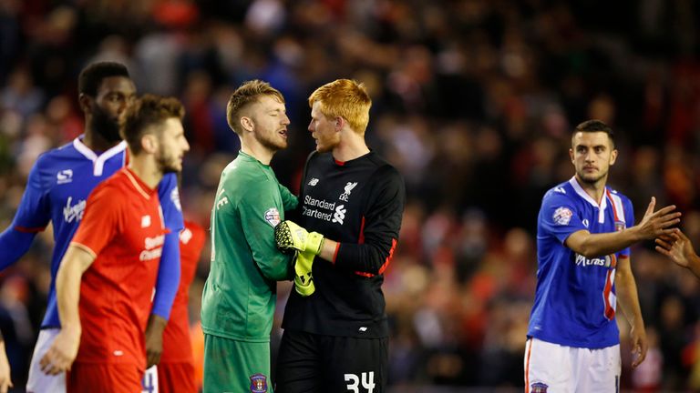 Liverpool goalkeeper Adam Bogdan (second right) shakes hands with Carlisle United goalkeeper Mark Gillespie after the Capital One Cup, third round match 