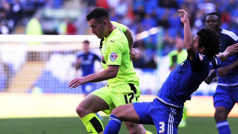 Fabio  challenges for the ball with Harry Bunn
