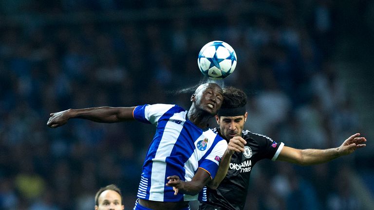 Danilo Pereira wins an aerial duel with Cesc Fabregas