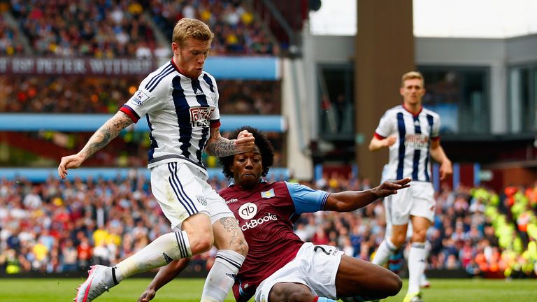 Chris Brunt and Carlos Sanchez  compete for the ball