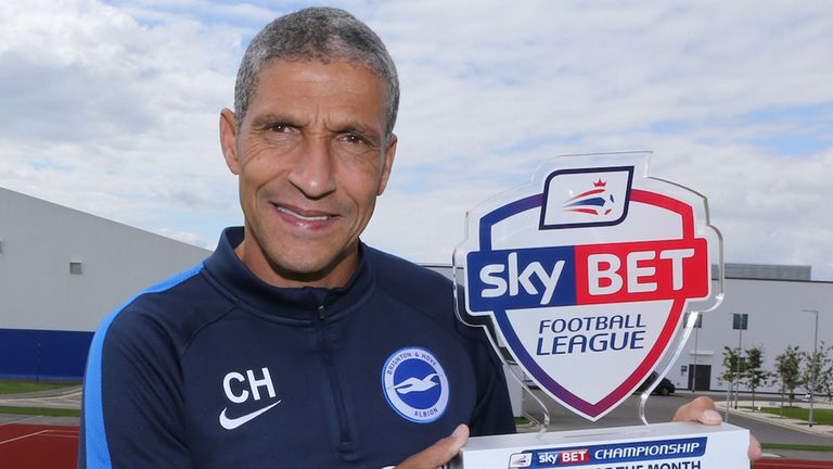 Brighton boss Chris Hughton is celebrating too