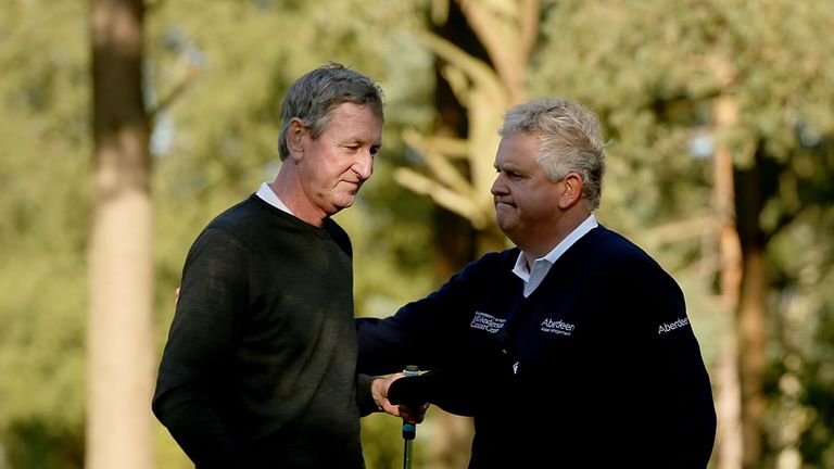 Colin Montgomerie consoles Ross Drummond after Montgomerie wins the play-off at the Travis Perkins Masters
