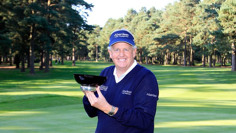 Colin Montgomerie of Scotland poses with the trophy after winning the Travis Perkins Masters at Woburn