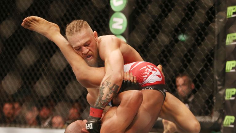 Ireland's Connor McGregor (top) against Brazil's Diego Brandao during their 5-Round Featherweight bout at the UFC Fight Night at the O2 in Dublin.