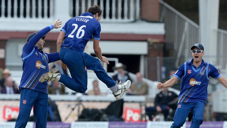 Gloucestershire's James Fuller (centre) celebrates bowling out Surrey's Steven Davies