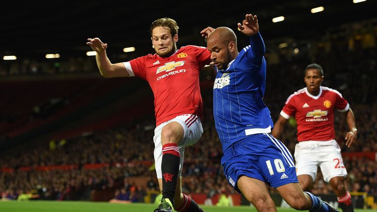 Ipswich Town's David McGoldrick (right) battles for the ball with Manchester United's Daley Blind