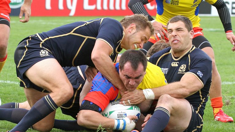 Romania's Daniel Carpo scores a try during the 2011 Rugby World Cup pool B match against Scotland