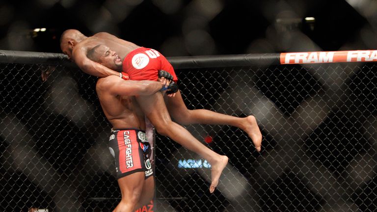 LAS VEGAS, NV - JANUARY 03:  Light heavyweight champion Jon Jones is lifted up by Daniel Comier during the UFC 182 event at the MGM Grand Garden Arena on J