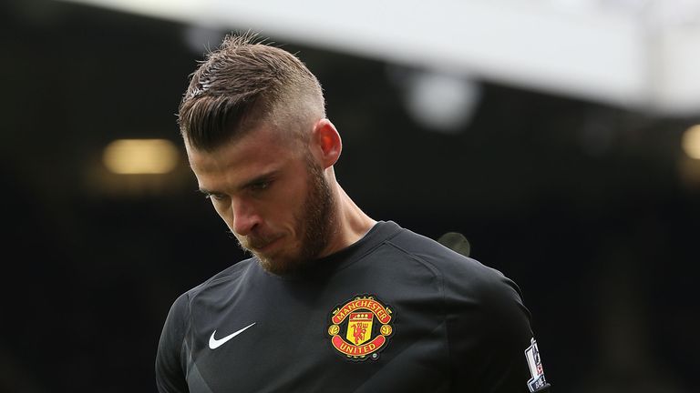 David de Gea of Manchester United leaves the pitch with an injury during the Barclays Premier League match between Manchester United and Arsenal
