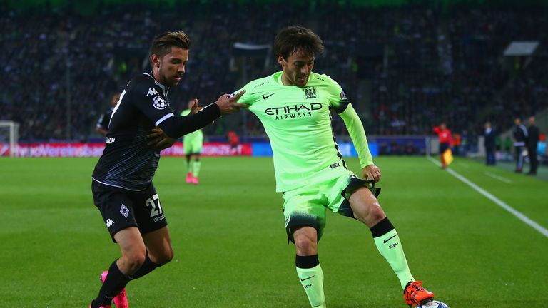 David Silva of Manchester City holds off Julian Korb of Borussia Monchengladbach during the Champions League clash