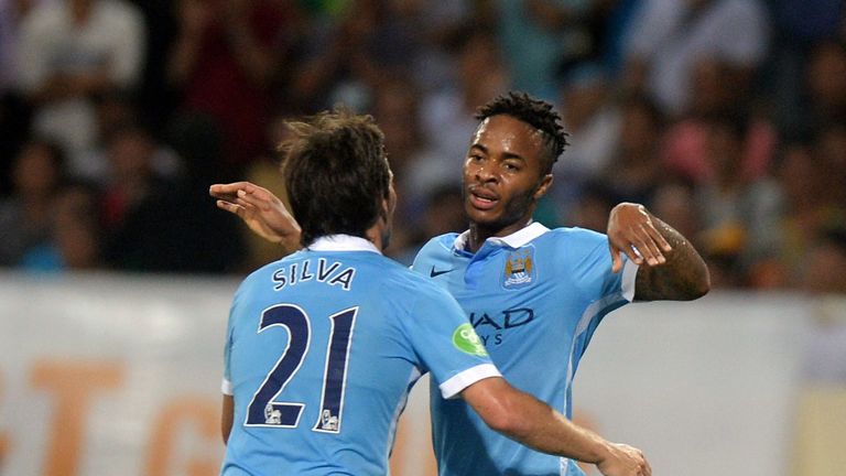 Manchester City's David Silva (L) and Raheem Sterling