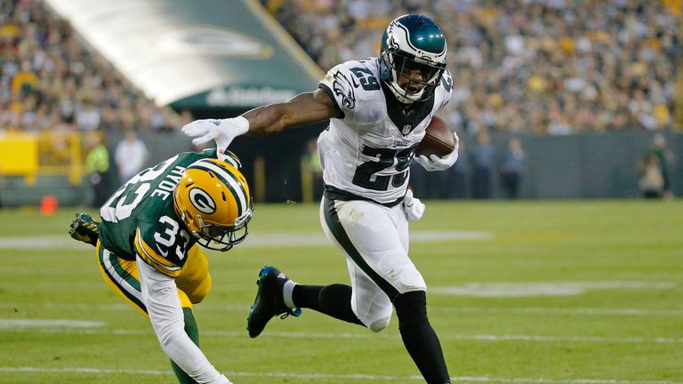 DeMarco Murray #29 of the Philadelphia Eagles stiff arms Micah Hyde #33 of the Green Bay Packers during the first quarter of a p