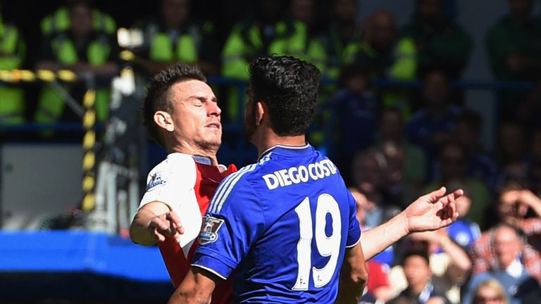 Diego Costa of Chelsea and Laurent Koscielny of Arsenal clash during the Barclays Premier League match between Chelsea and Arsenal at Stamford Bridge