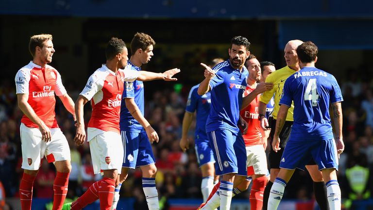 LONDON, ENGLAND - SEPTEMBER 19: Diego Costa of Chelsea speaks to referee Mike Dean during the Barclays Premier League match between Chelsea and Arsenal at 