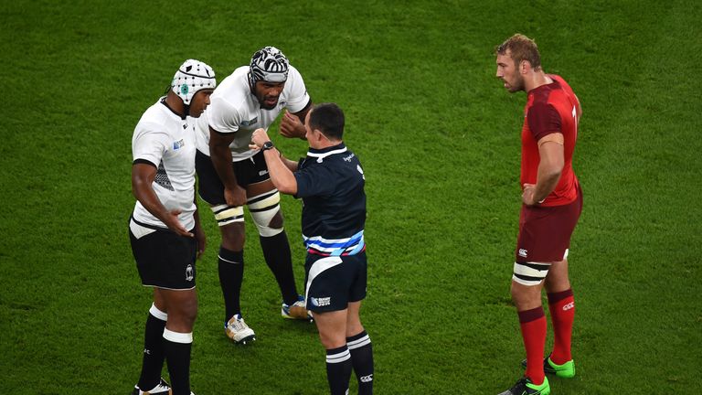 Referee Jaco Peyper talks to Fiji's Dominiko Waqaniburotu (second from left) at Twickenham