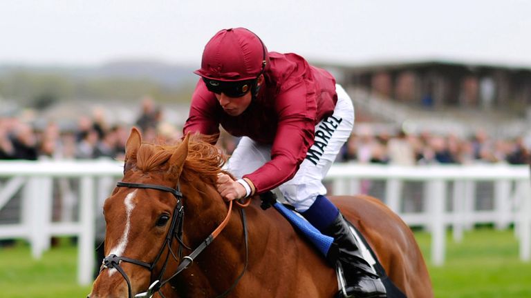 NEWBURY, ENGLAND - APRIL 12: William Buick riding Eagle Top win The Al Basti Equiworld Maiden Stakes at Newbury racecourse on April 12, 2014 in Newbury, En