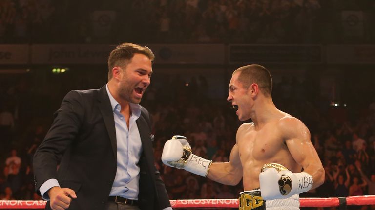 MANCHESTER, ENGLAND - JULY 18: Scott Quigg celebrates beating Kiko Martinez with promoter Eddie Hearn during their WBA World Super Bantamweight Championshi