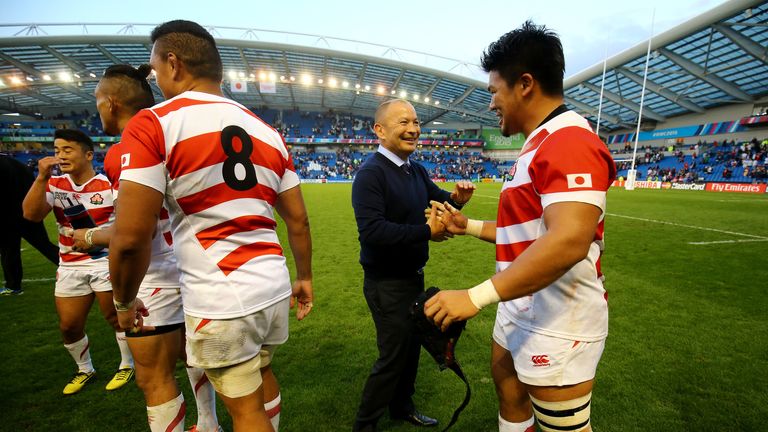 Japan's Coach Eddie Jones congratulates his team following victory over South Africa during the Rugby World Cup match at the Brighton Community Stadium