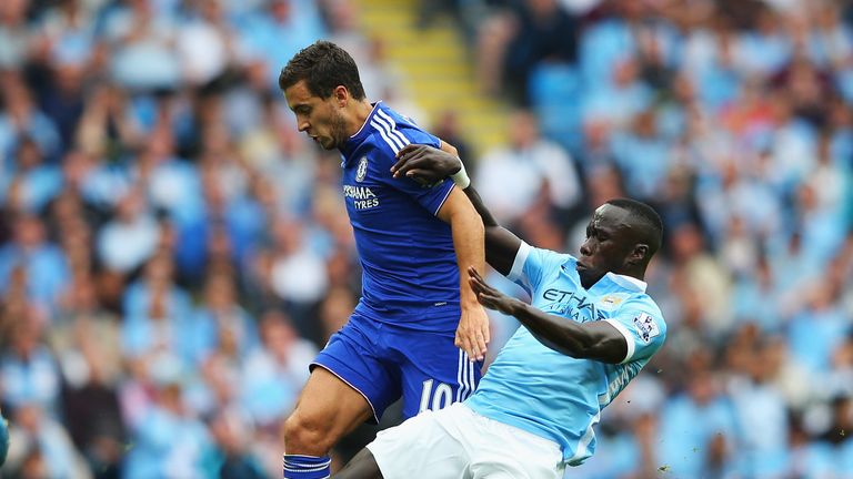 MANCHESTER, ENGLAND - AUGUST 16: Eden Hazard of Chelsea is tackled by Bacary Sagna of Manchester City during the Barclays Premier League match between Manc