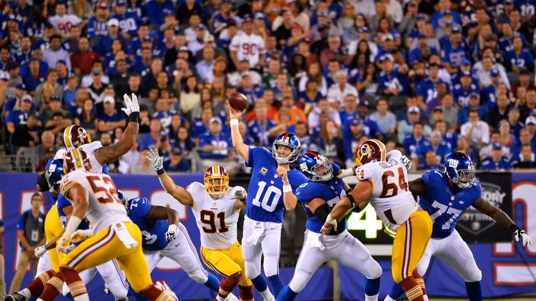 Eli Manning #10 of the New York Giants passes against the Washington Redskins