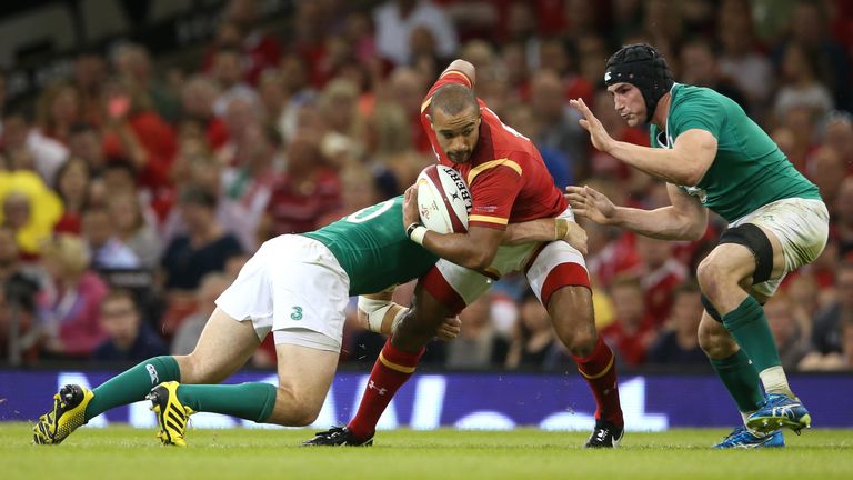 Eli Walker is tackled during Wales' match against Ireland on August 8