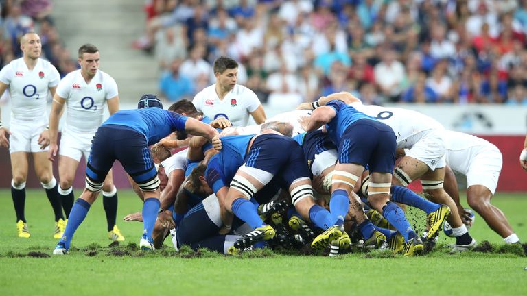 The scrum collapses as the turf moves during the match between France and England at Stade de France
