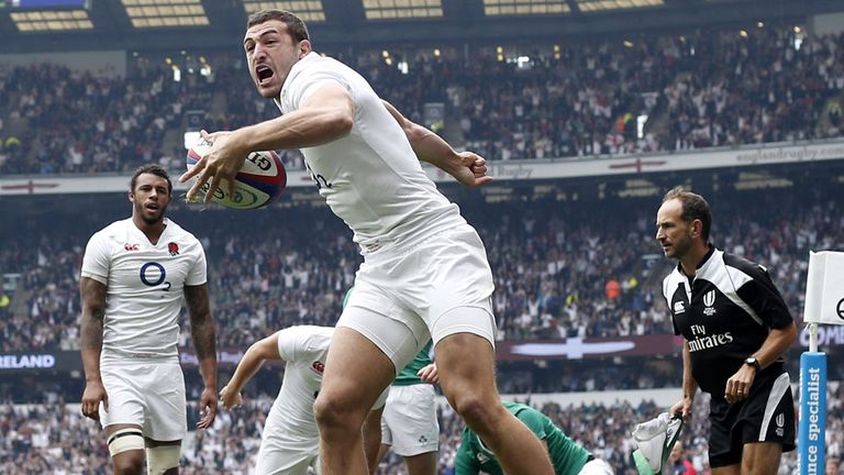 England's wing Jonny May (2nd R) celebrates scoring his early try during the international rugby union friendly match between England and Ireland