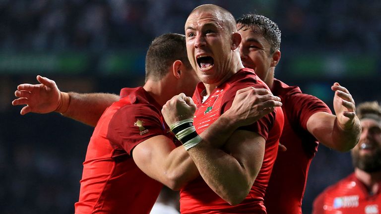 England's Mike Brown celebrates scoring his side's first try during the Rugby World Cup match at Twickenham Stadium, London.