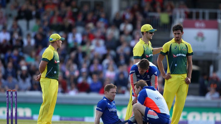 England captain Eoin Morgan receives treatment after being struck on the head by a short ball from Mitchell Starc of Australia in the fifth ODI.